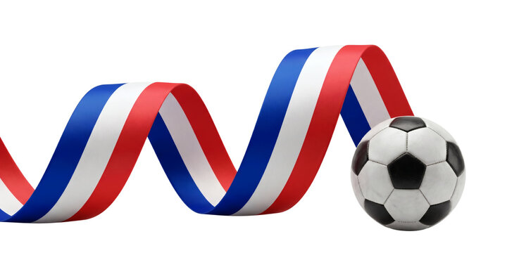 A classic black and white soccer ball positioned next to a flowing, wavy ribbon featuring the colors of the French flag, isolated on a white background.