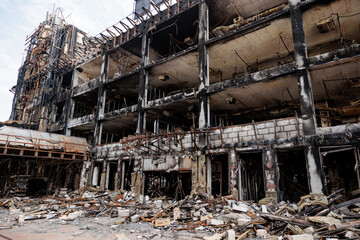 Fototapeta premium A burned-out shopping mall building after being hit by a missile. The aftermath of Russia's missile attack on the Ukrainian capital, Kyiv.