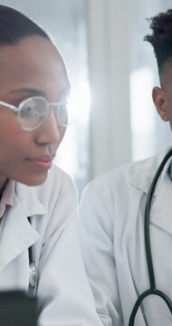 Doctor, team and discussion in hospital with computer, medical research and problem solving together. Flare, healthcare worker and black people in clinic with pc, talk and review online test results.