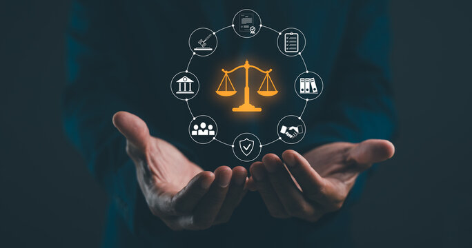 Two hands hold a glowing scale of justice icon surrounded by law-related symbols connected in a circular network on a dark background.
