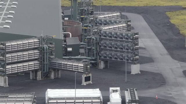 Direct air capture units operate at an industrial site with modular structures outdoors