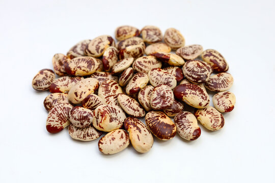 Raw lima beans on white background.