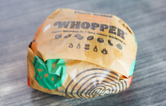 Jakarta, Indonesia - May 23, 2026: Closeup of a wrapped Burger King Whopper.