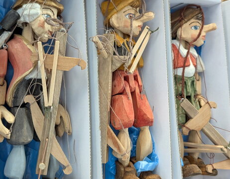 Traditional Czech Wooden Marionettes Displayed in Boxes