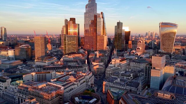 Panoramic aerial view of the City of London, England, skyline with Bank and Cornhill during golden sunset time