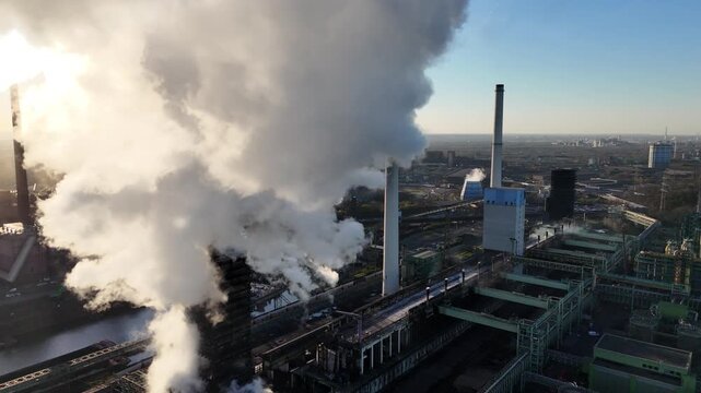 Emerging through smoke toward industrial complex