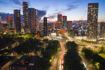 Aerial Night Image of Manchester Skyscraper Skyline and Highway © bardhok