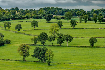 Green pastures and rolling hills in rural Normandy France © Luc V. de Zeeuw