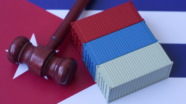 The cargo container ban on the Cuba flag as a conceptual backdrop for the export and logistics of goods. The cargo container embargo on the Cuban flag as a backdrop for your design