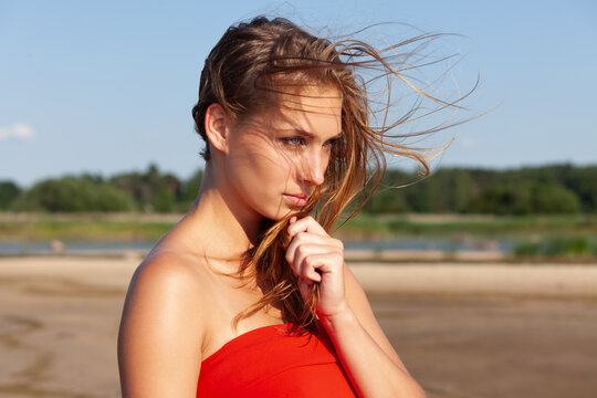 Young woman wearing red top outdoors