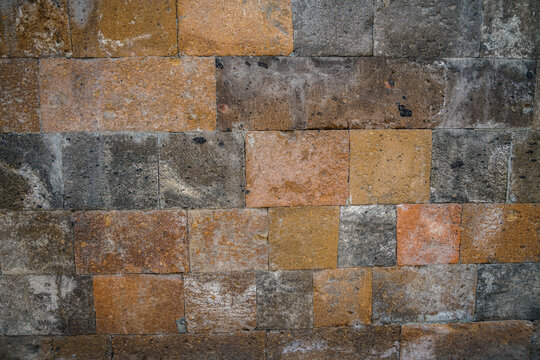 Textured Tuff Stone Wall Blocks in Yerevan, Armenia, Exhibiting Varied Earth Tones and Rough Surfaces