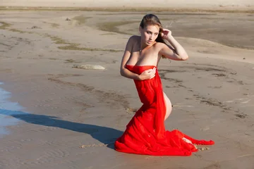 Nude Woman Kneeling On Sandy Beach © misu