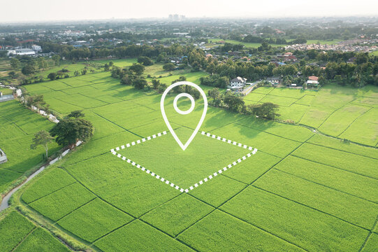 Land with GPS location pin and surveyed parcel boundary. Real estate concept representing land plot, surveying, cadastral mapping, land valuation, GIS mapping, zoning analysis, farmland management.
