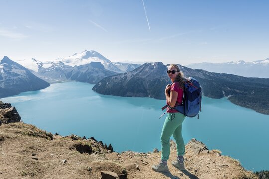 View from Panorama Ridge Hiking Trail, Hiker, Garibaldi Lake, Guard Mountain and Deception Peak, Glacier, Garibaldi Provincial Park, British Columbia, Canada