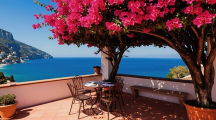 Obraz premium Terrace with pink bougainvillea tree overlooks blue sea and coastline. Outdoor cafe table and chairs await guests for dining. Sunny day at a resort town.