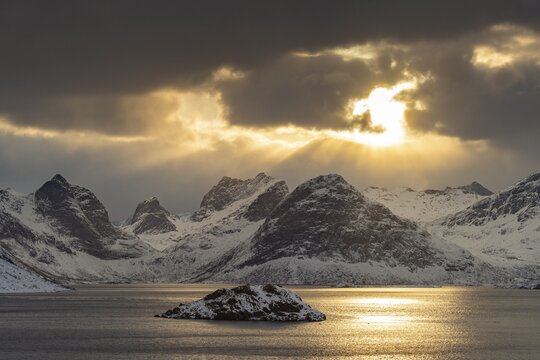 Winter Scandinavian landscape by the fjord, sea, mountains, snow, Ramberg, Nordland, Lofoten, Norway