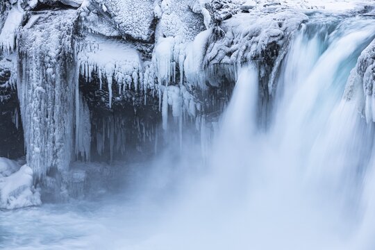 Godafoss waterfall, icy and snowy rock face, Northern Iceland Eyestra, Iceland