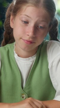 Frustrated Caucasian girl little girl child kid doubtful pupil looking at camera shrugging shoulders at school studying problem daughter shrug hesitate reaction fail exam difficult study education