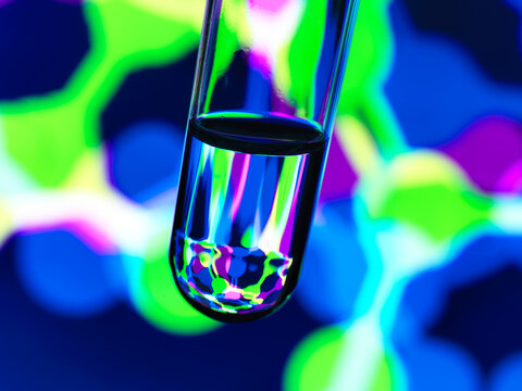 Biotechnology research, Test tube containing a chemical formula with a illustration of structure on the screen in the laboratory