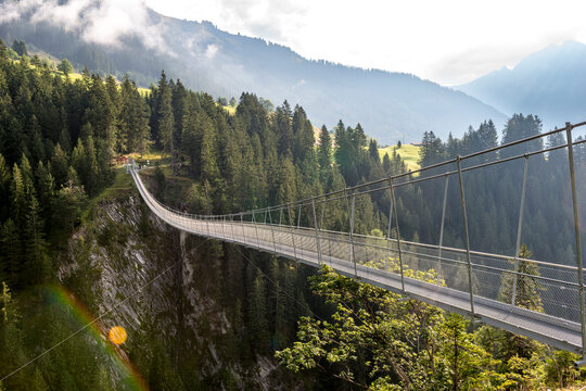 Suspension bridge over a gorge in the Alps of Tyrol Austria