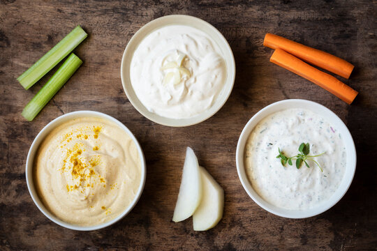 Variation of sour cream with vegetable stick kept on table