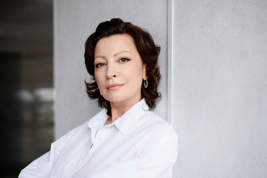 Confident businesswoman looking at camera in workspace