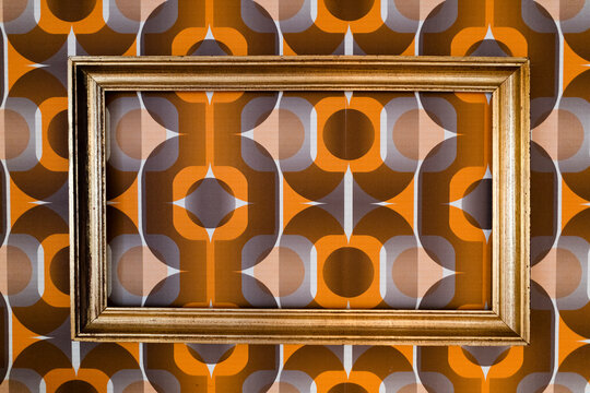 Empty picture frame at vintage wallpaper pattern