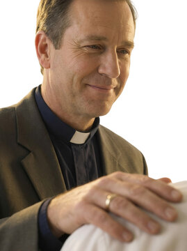 Compassionate Catholic Priest Offering Blessing and Spiritual Support