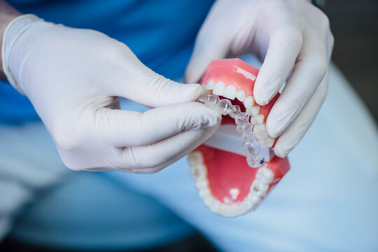 Close-up of dentist working on dentures