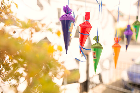 Miniature school cones hanging in a row