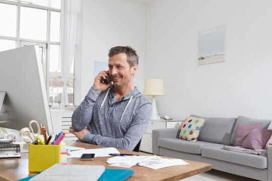Man at desk on the phone