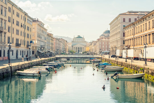 Italy, Friuli-Venezia Giulia, Trieste, Boats moored along Canal Grande in summer