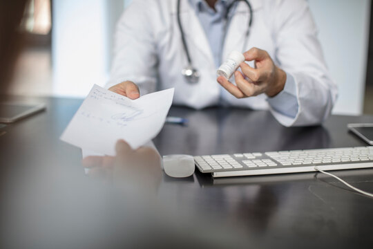 Doctor giving patient a note