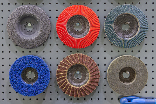 Various Types of Angle Grinder Abrasive Discs Tools at Pegboard in Workshop