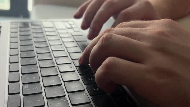 Close-up video of a laptop keyboard used for work, communication and digital tasks. Technology and productivity concept representing modern office, remote work and everyday computing.
