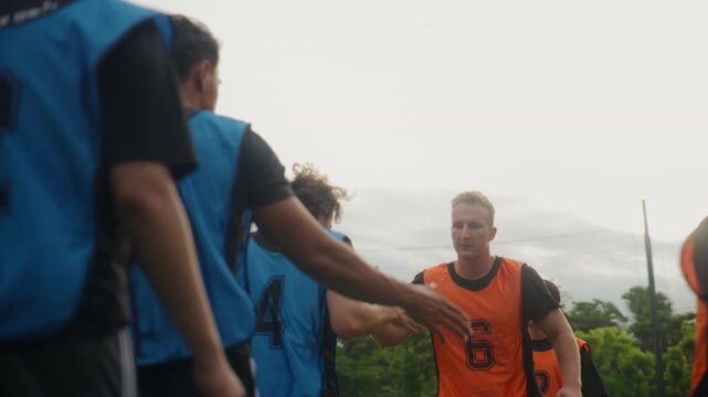 Football Referee Explaining Match Rules and Inviting Players to Shake Hands Before Kickoff