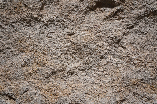 Weathered rough stone wall texture with natural grains from Orleans, France