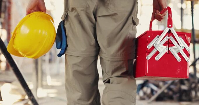 Helmet, hands and man on construction site with toolbox infrastructure and property inspection. Architecture, back of civil engineer and walking with PPE equipment, renovation and remodeling project