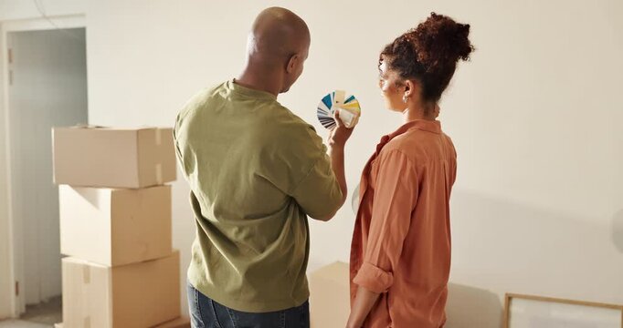 New home, couple and paint swatch for interior design, property remodeling or discuss decision. African man, woman or color options for wall renovation, house decor or help with real estate from back