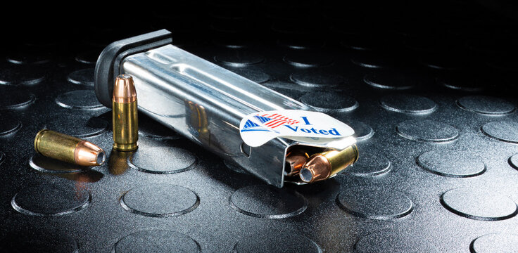 Sticker on a loaded gun magazine that says I voted