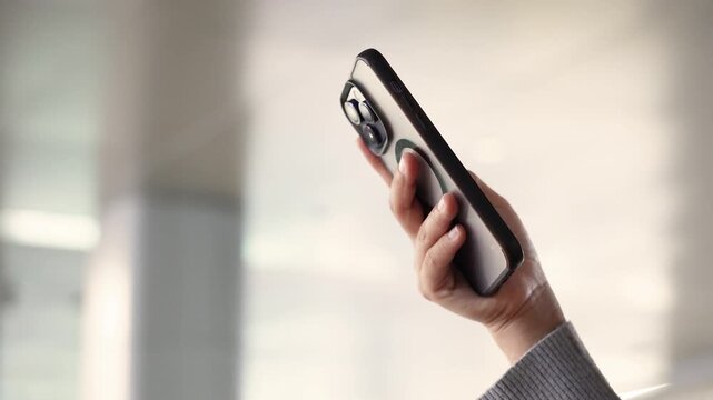 Close up woman using smartphone for online shopping, browsing internet and communications. Generation Z lifestyle people hand holding phone text Chatbot digital technology, finance or remote working. 