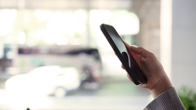 Close up woman using smartphone for online shopping, browsing internet and communications. Generation Z lifestyle people hand holding phone text Chatbot digital technology, finance or remote working. 