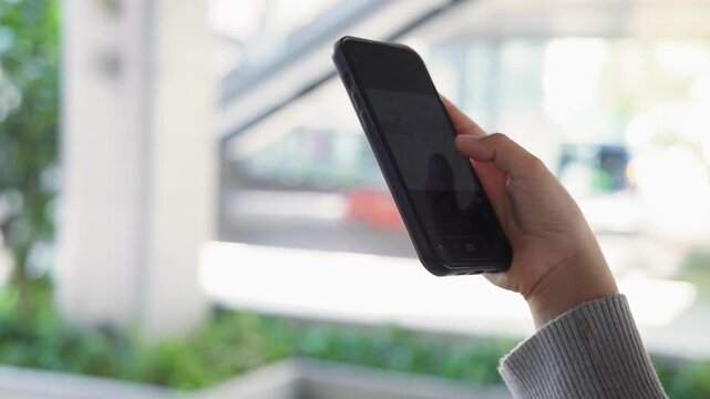 Close up woman using smartphone for online shopping, browsing internet and communications. Generation Z lifestyle people hand holding phone text Chatbot digital technology, finance or remote working. 