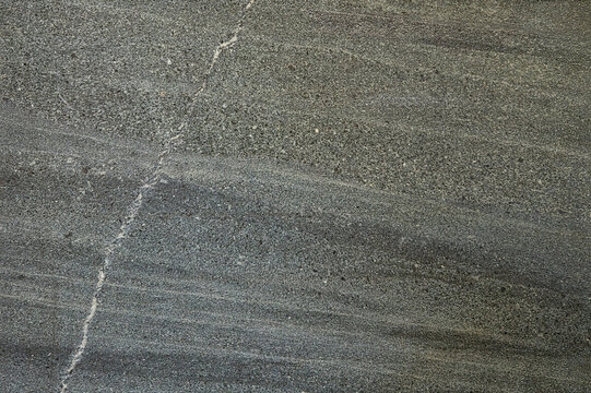 Matte dark grey stone texture background surface