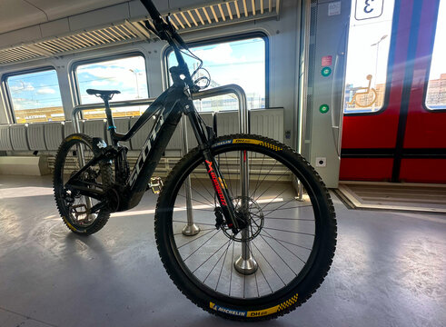 Bike transporting in train carriage. MTB E-Bicycle transported in passenger Stadler train. Electric bicycle ebike with Bosch Performance Line CX motor. Scott E-Mountainbike. May 21, 2026, Lithuania.