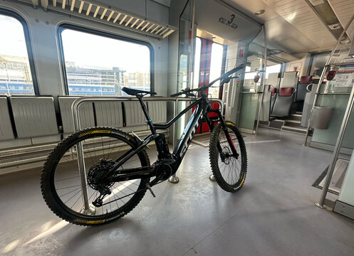 Bike transporting in train carriage. MTB E-Bicycle transported in passenger Stadler train. Electric bicycle ebike with Bosch Performance Line CX motor. Scott E-Mountainbike. May 21, 2026, Lithuania.