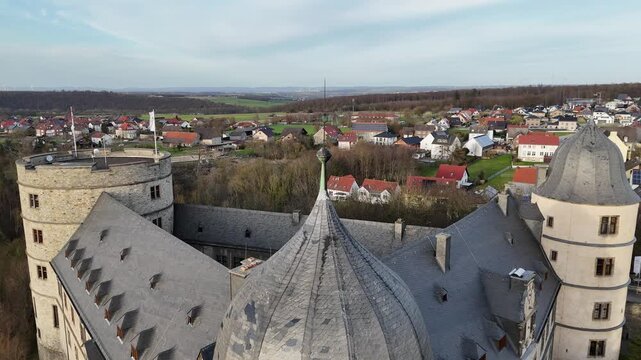 Rear pullback revealing the triangular castle layout