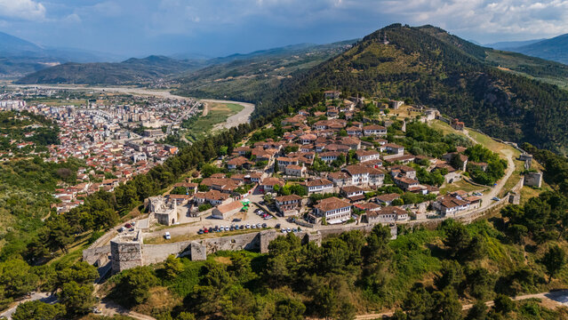 Drone shot of Kalaja e Beratit, the medieval fortress overlooking the historic old town in Albania. Scenic landscape of the famous UNESCO world heritage site from above