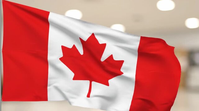 A red and white waving flag of a country with a maple leaf