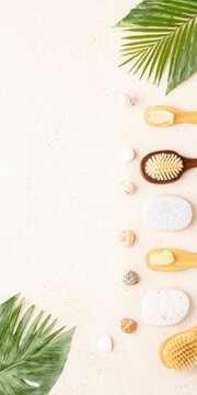 Spa accessories creating a border on sandy background